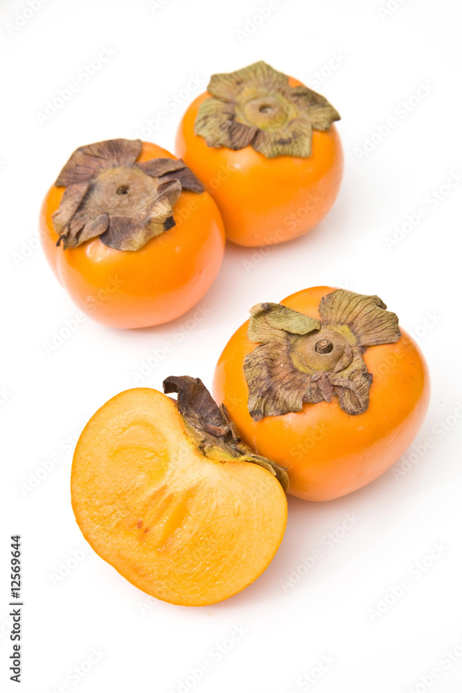 Sharon fruit isolated on a white studio background. Sharon fruit isolated on a white studio background.