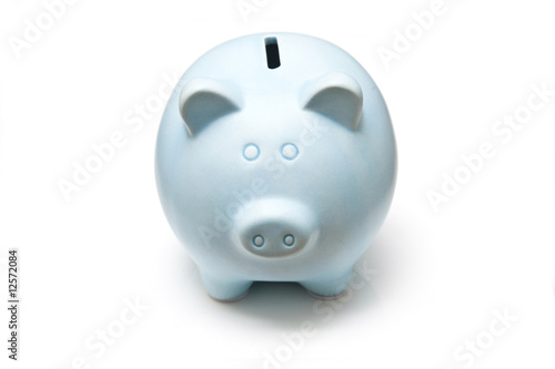 Blue piggy bank isolated on a white studio background. photo
