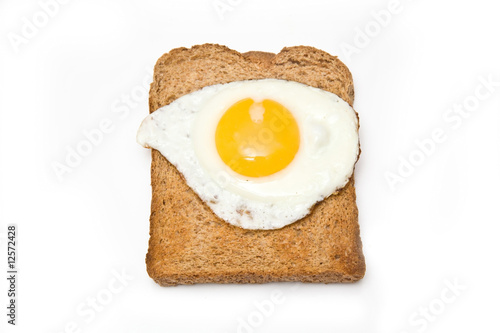 Fried egg ion toast isolated on a white studio background. photo