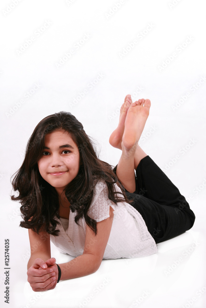Beautiful teen girl lying on floor relaxing Stock Photo | Adobe Stock