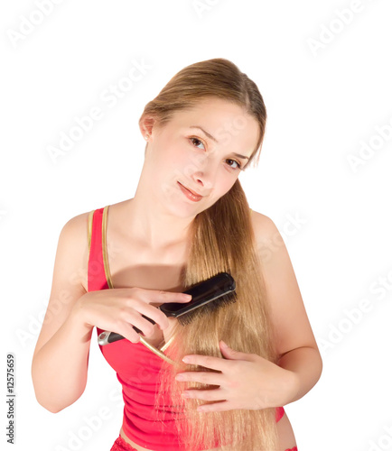 Girl combing her long hair