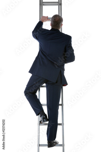 Businessman climbing a ladder