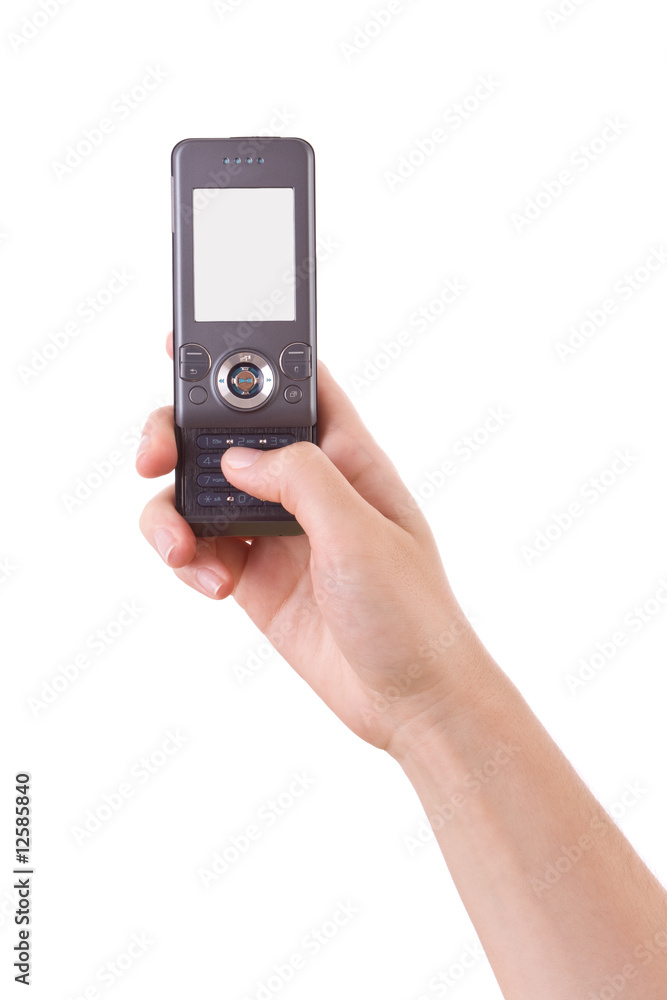 Hand holding and typing in a mobile phone isolated on white