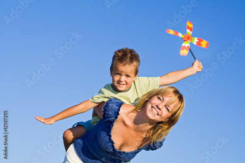 Woman and little boy playing