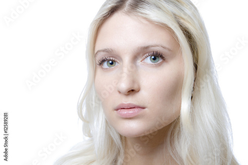 Pretty young woman with green eyes, isolated on white