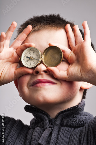 Little boy with compass photo