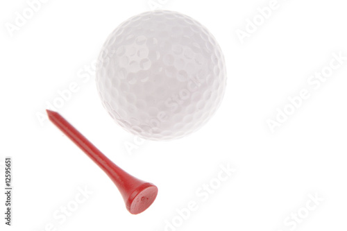 Golf ball and tee on white