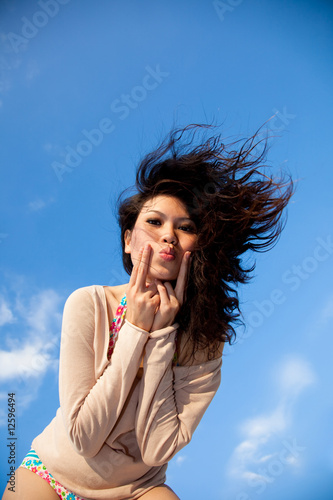 happy young woman with blue sky