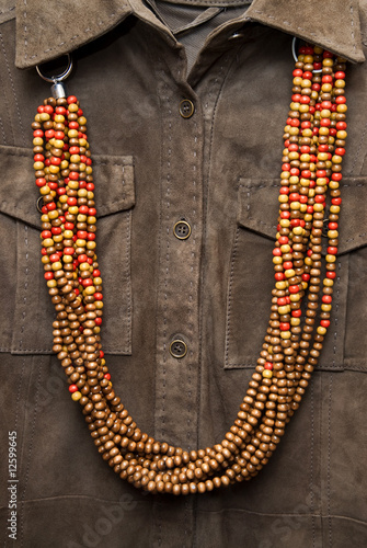 brown shirt with color necklace