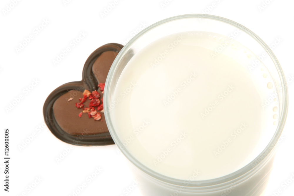 Snack time. Glass of milk and chocolate heart snack. Snack time. Glass of milk and chocolate heart snack.