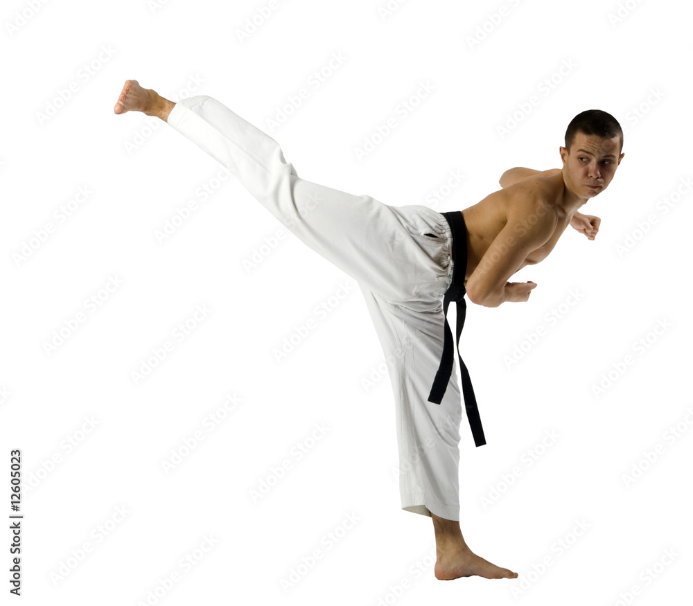 Young Sporty Karate Man Doing Special Exercise Isolated on White Young Sporty Karate Man Doing Special Exercise Isolated on White