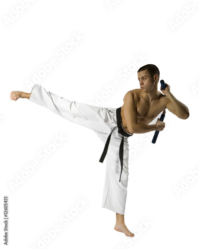 Young Sporty Karate Man Doing Special Exercise Isolated on White