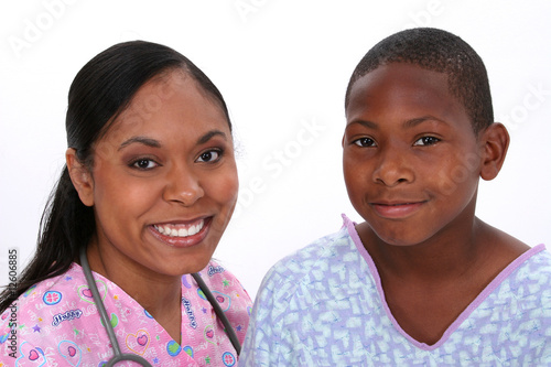 Happy African American nurse and child patient portrat.