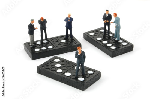 business man on domino isolated photo