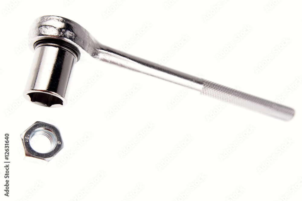 Wrench and nut isolated over white Wrench and nut isolated over white