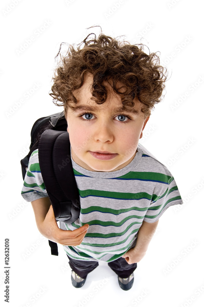 Young boy with backpack looking up isolated on white Young boy with backpack looking up isolated on white