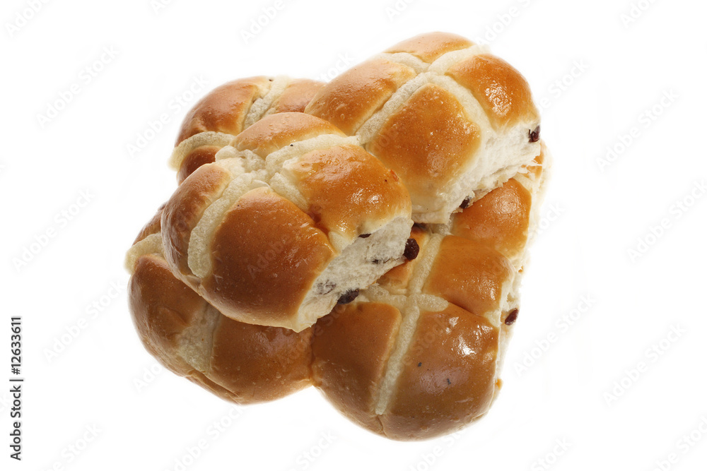Easter hot cross buns stacked on a flat plate