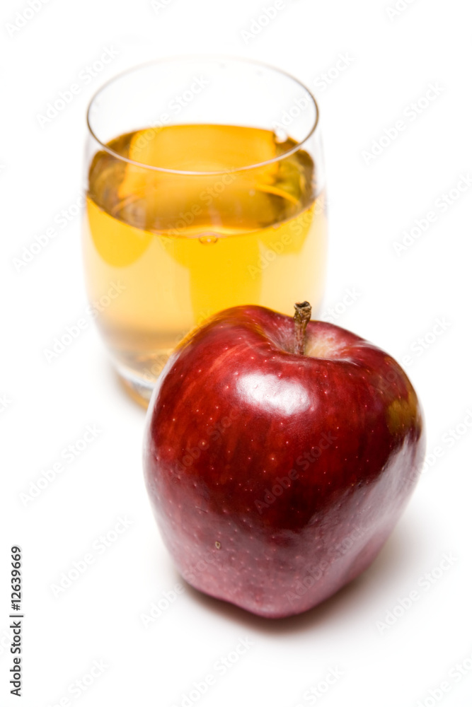 Glass of apple juice with a red apple Glass of apple juice with a red apple