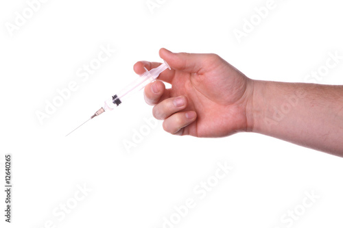 hand with the syringe on white background