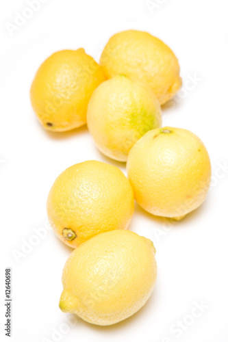 Lemons on a white studio background.