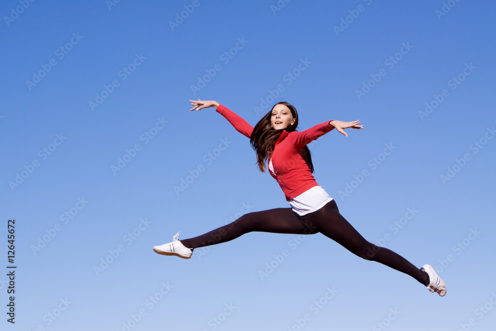 Young athletic woman jumping