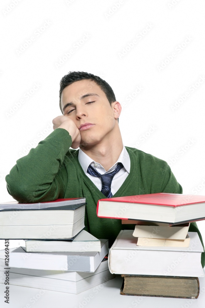 boy student sleeping over stack books over desk boy student sleeping over stack books over desk