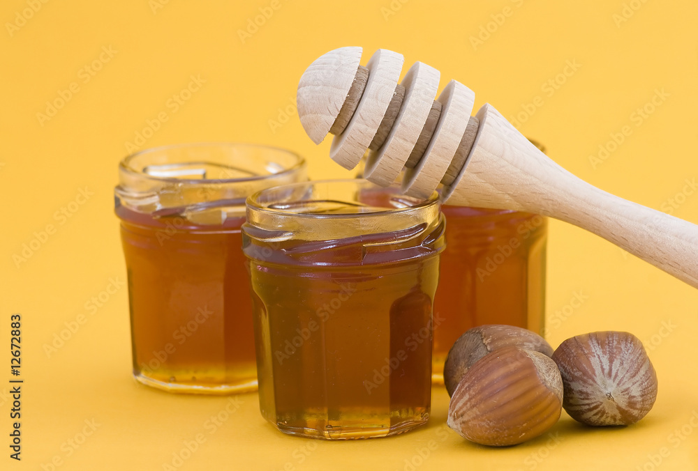 hazelnuts, honey and wooden drizzler hazelnuts, honey and wooden drizzler