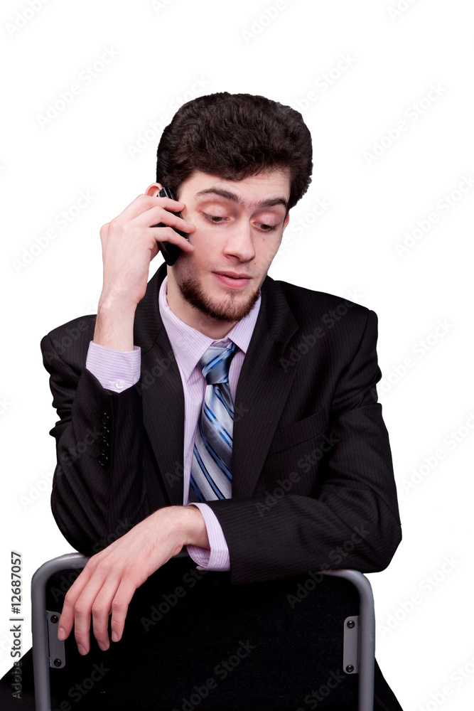 young businessman talking using mobile phone young businessman talking using mobile phone