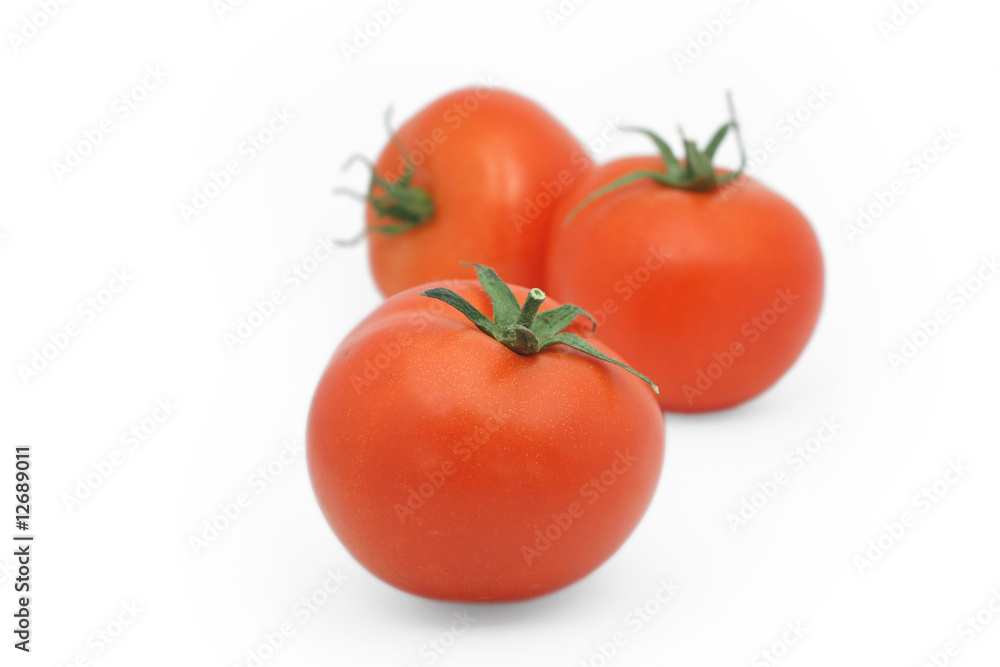 Red tomatoes isolated on white