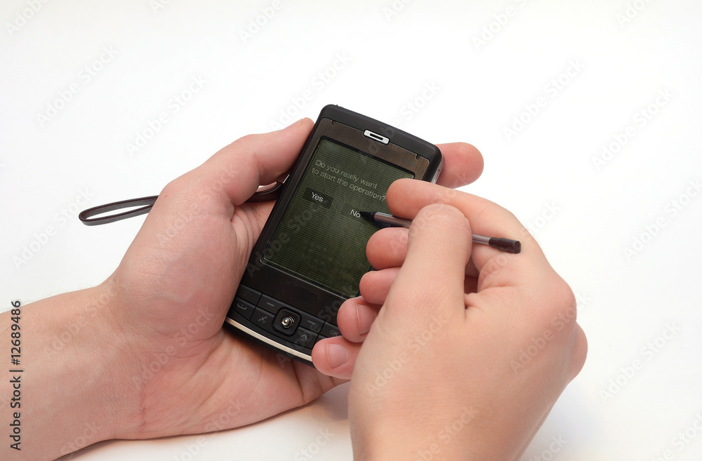 Manle hands with pocket PC isolated Manle hands with pocket PC isolated