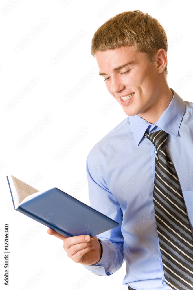 Young successful businessman reading organizer, isolated Young successful businessman reading organizer, isolated