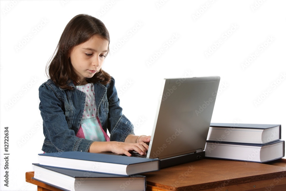 Young Girl / Child Typing On Laptop Computer Young Girl / Child Typing On Laptop Computer
