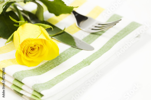 Place setting with yellow rose