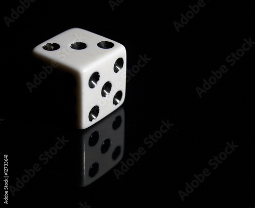 white dice reflected on black