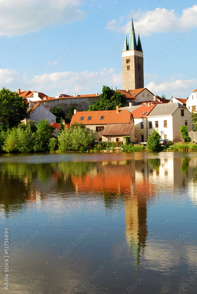 Tower and Houses with Lake Reflection Tower and Houses with Lake Reflection