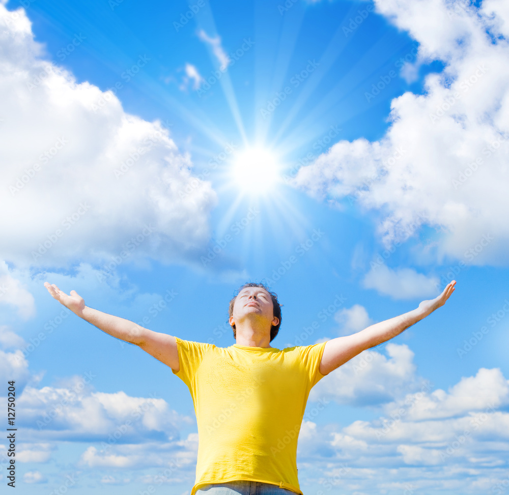 Man spreading his arms to the sun Man spreading his arms to the sun