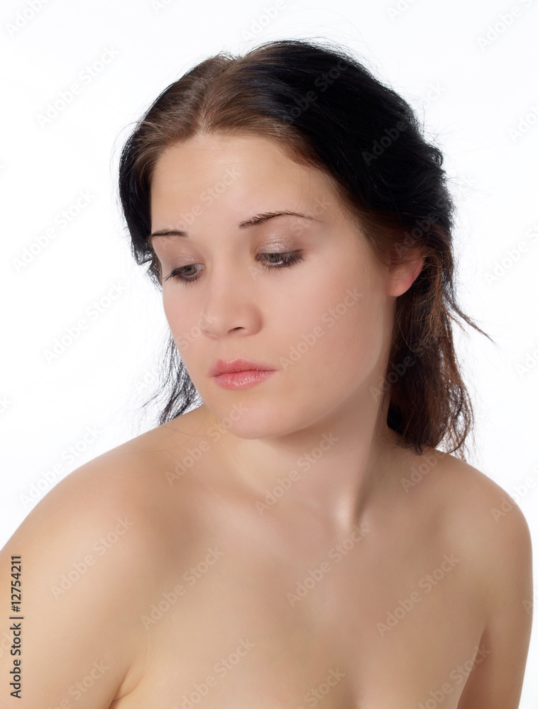 Young woman with bare shoulders portrait looking down Young woman with bare shoulders portrait looking down