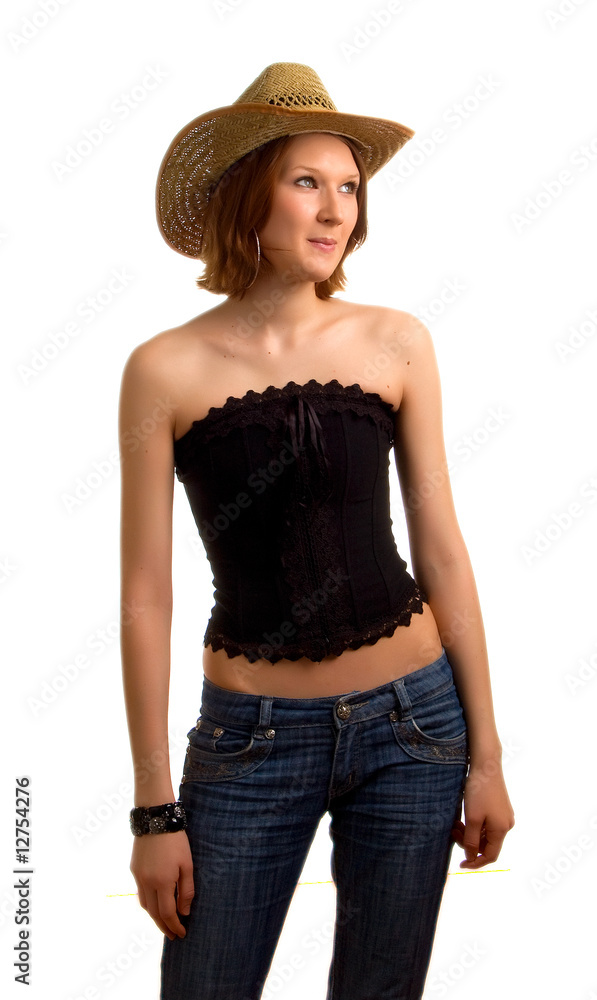 young girl in a straw hat and dark blue jeans young girl in a straw hat and dark blue jeans