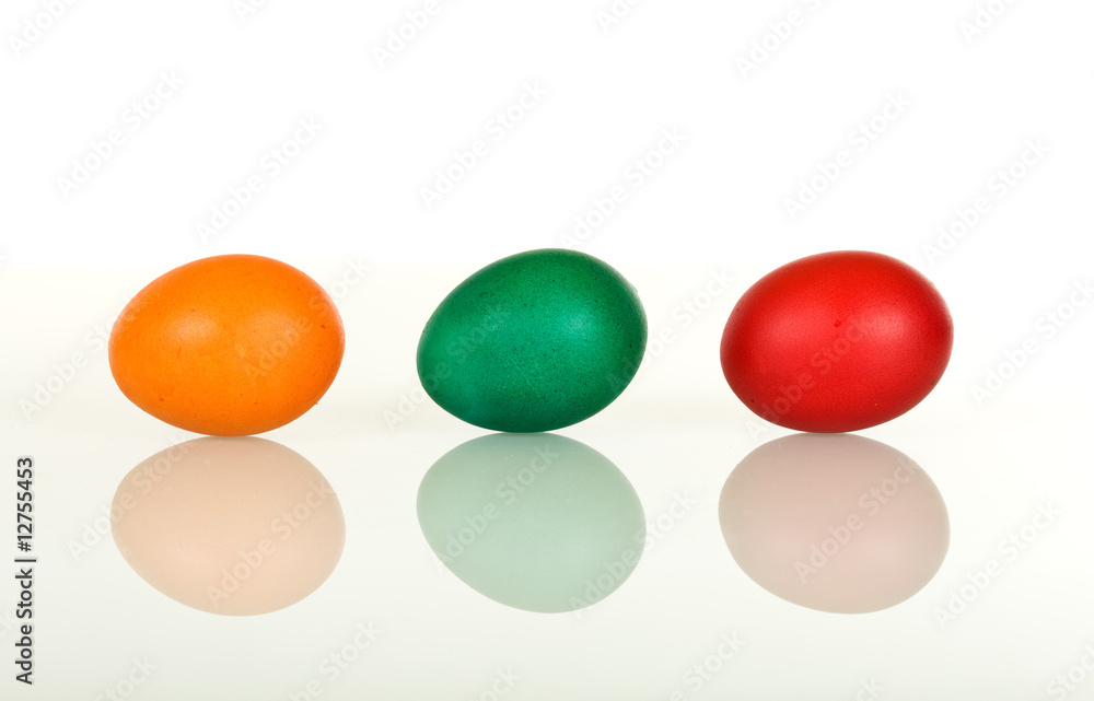 Yellow green and red easter eggs in a row