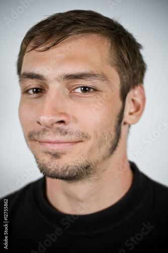 beardy male smiling in a portrait