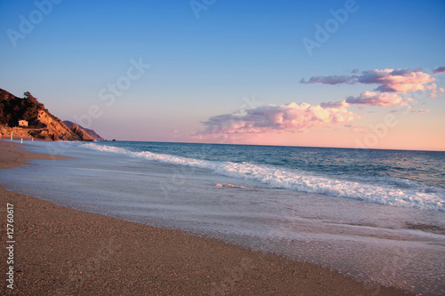 Mediterranean beach in sunset,liguria , italy