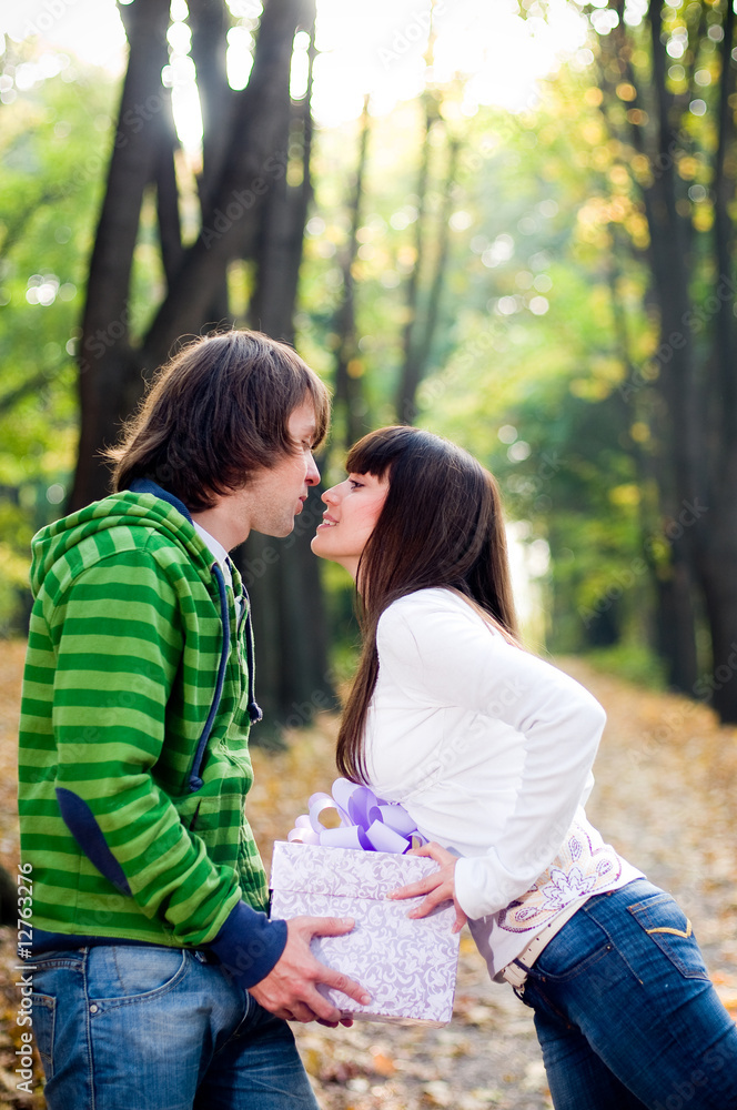 Fototapeta premium Young couple kissing