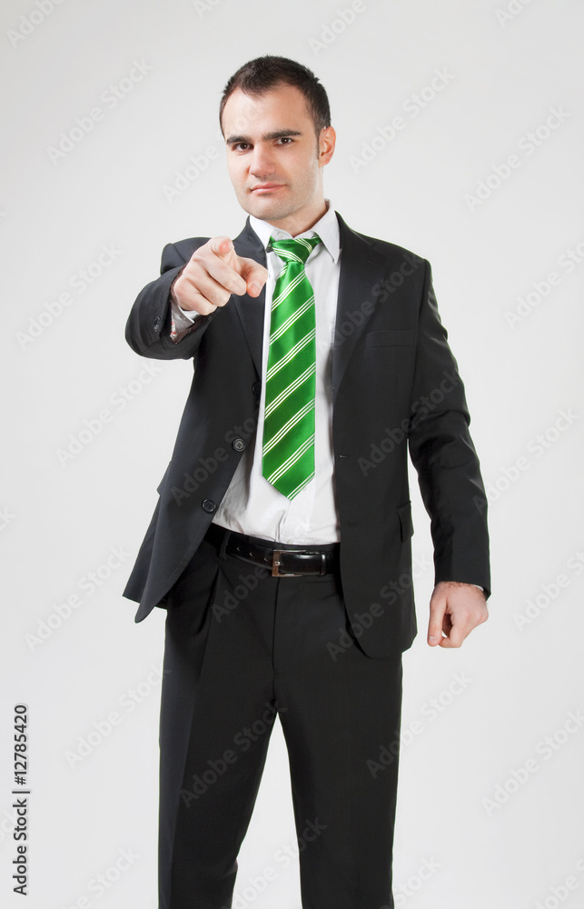 portrait of businessman pointing at the camera portrait of businessman pointing at the camera