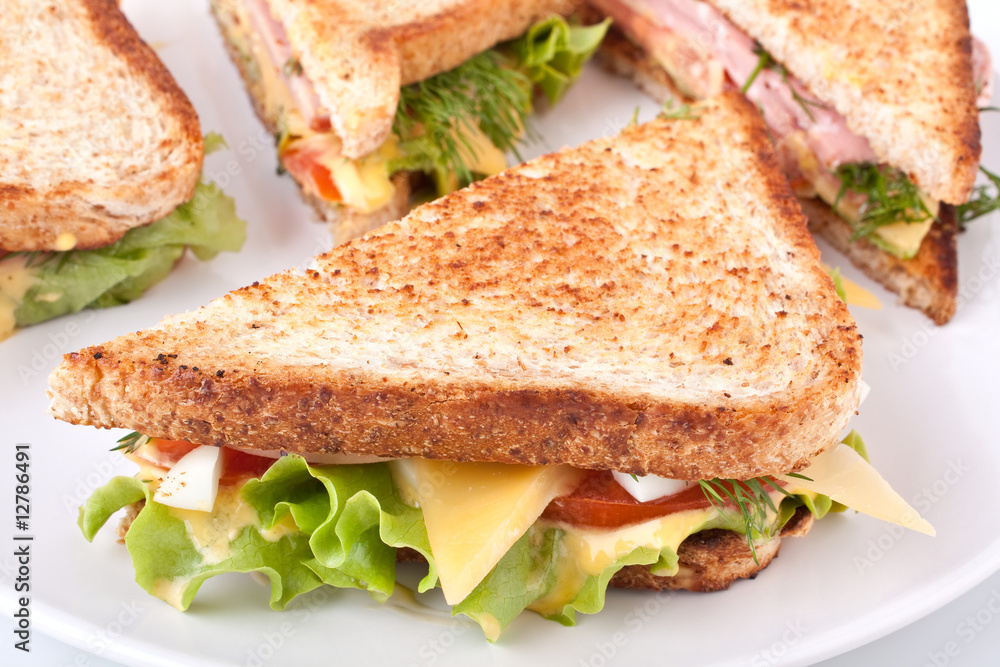 meat, lettuce and cheese sandwich on toasted bread meat, lettuce and cheese sandwich on toasted bread