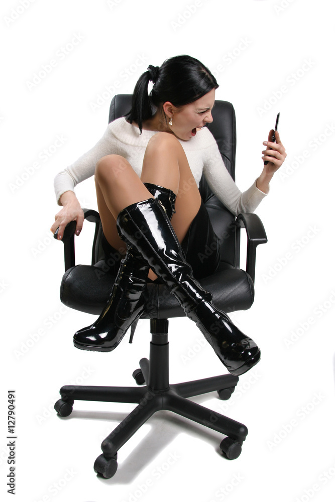 Young rage shout businesswoman on cell phone isolated on white Young rage shout businesswoman on cell phone isolated on white