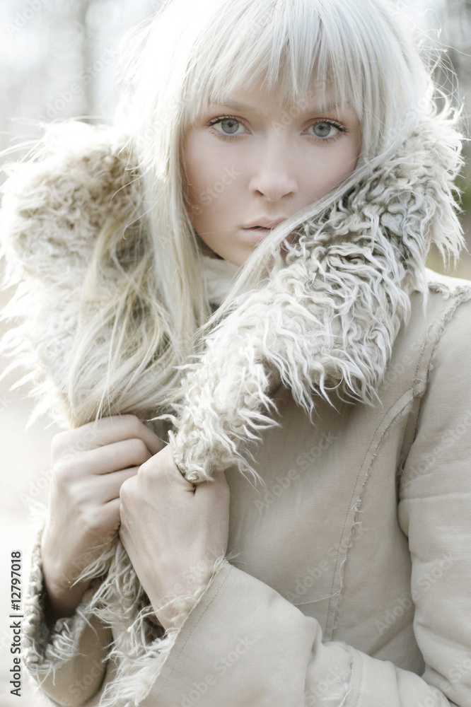 Portrait of a beautiful girl wearing white fur Portrait of a beautiful girl wearing white fur
