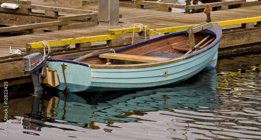 Small Blue Boat at a Pier