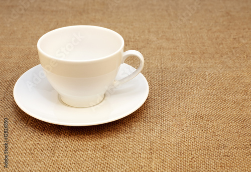 white cup at the textile background