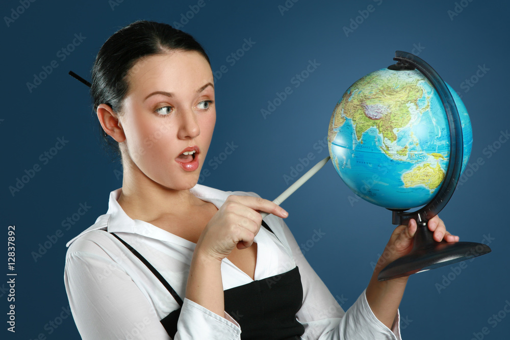Closeup portrait of a gorgeous teacher with globe Closeup portrait of a gorgeous teacher with globe