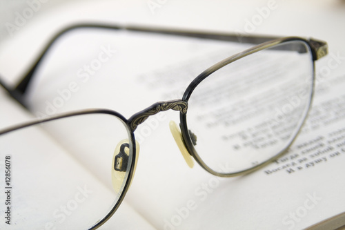 Glasses on the book. Macro shoting